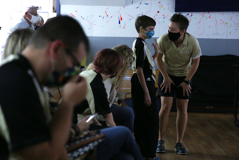 Kelsey Warren talks with Landen Palmer after he finished bowling